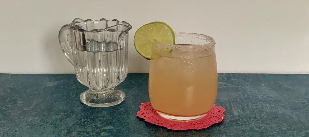 Paloma with fresh pink grapefruit and pink himalayan salt rim - banner image